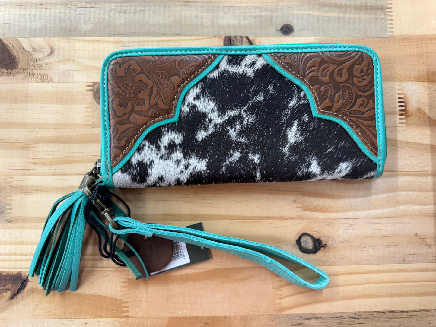 Turquoise hair on leather wallet